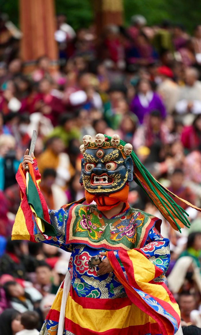 The Art of Drawing Readers In: Your attractive post title goes here Colorful traditional mask dance performed at a lively cultural festival, captivating the crowd.